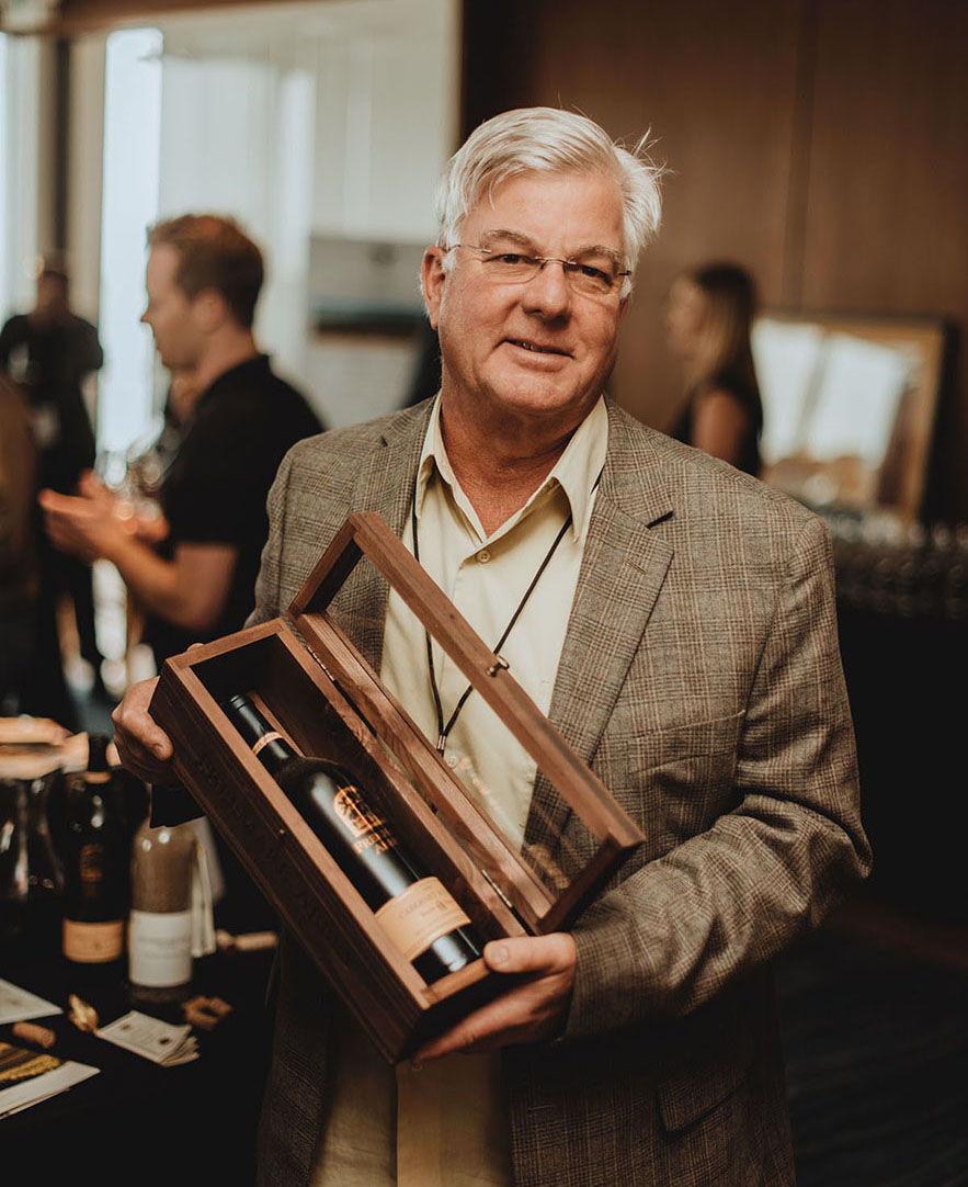 Ted Edwards with a bottle of Freemark wine