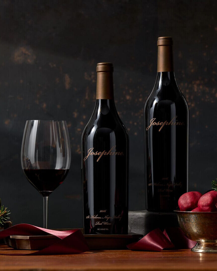 freemark abbey josephine red wine on a table with fruit