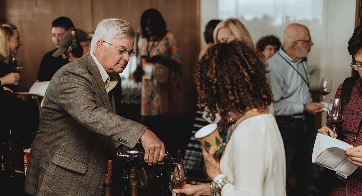 Ted Edwards pouring wine
